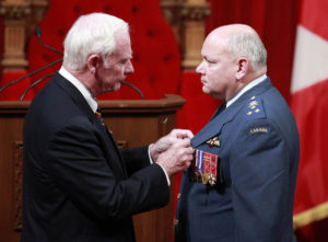 Canada's Governor General Johnston awards Lieutenant General Bouchard with the Meritorious Service Cross during a ceremony in Ottawa