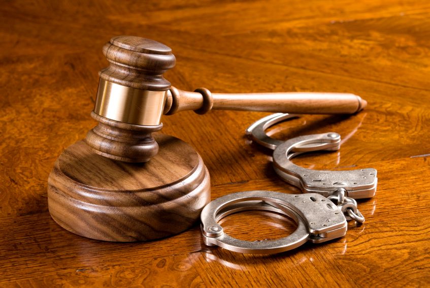 Gavel and handcuffs Healthcare Fraud
