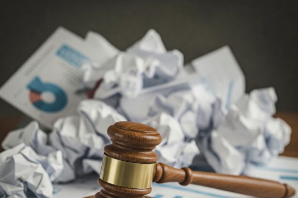 Gavel and handcuffs on financial documents symbolizing federal sentencing for embezzlement, wire fraud conspiracy, and aggravated identity theft.