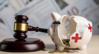 Symbolic image of justice for Medicare fraud: a gavel beside a broken piggy bank with medical symbols, representing the NOVA DME healthcare fraud scheme and sentencing.